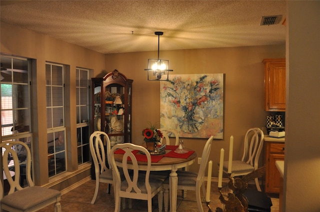 1720 Red Oak Cir, Sulphur Springs, TX 75482 - tiled dining room with a textured ceiling
