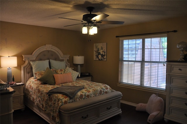 1720 Red Oak Cir, Sulphur Springs, TX 75482 - bedroom with dark wood finished floors, baseboards, and ceiling fan