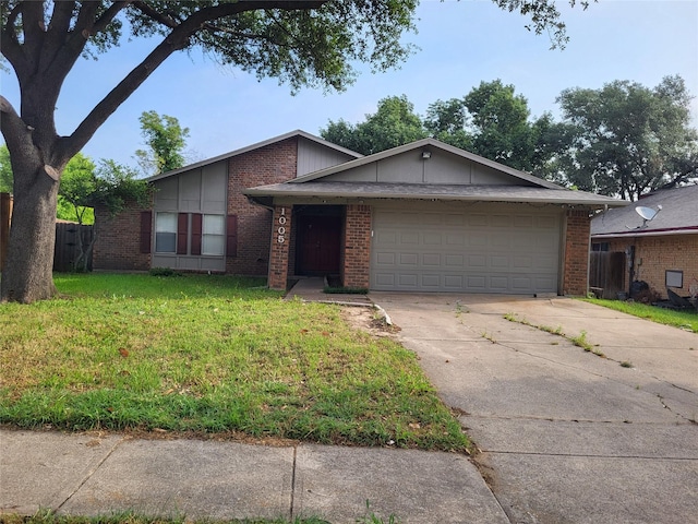 1005 Via Balboa, Mesquite, TX 75150 - mid-century home with driveway, an attached garage, brick siding, and a front yard