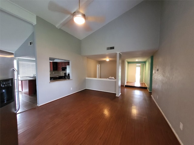 1005 Via Balboa, Mesquite, TX 75150 - unfurnished living room featuring high vaulted ceiling, ceiling fan, wood finished floors, and baseboards