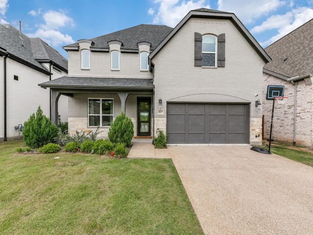 4837 Cumberland Cir, Carrollton, TX 75010 - french country home with concrete driveway, a garage, a front yard, brick siding, and roof with shingles