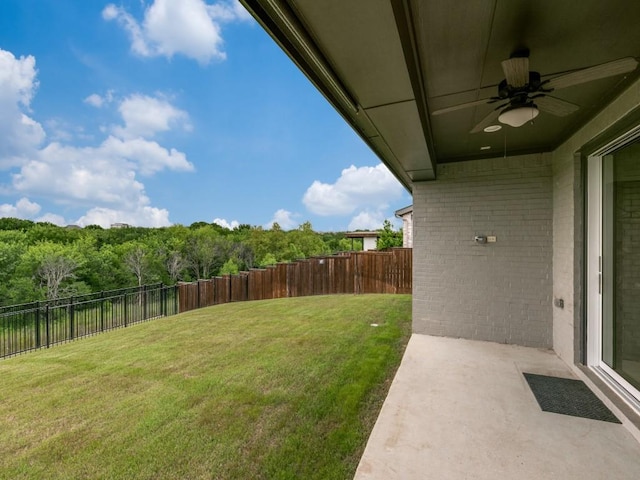 4837 Cumberland Cir, Carrollton, TX 75010 - view of yard featuring ceiling fan, a patio area, and a wooded view