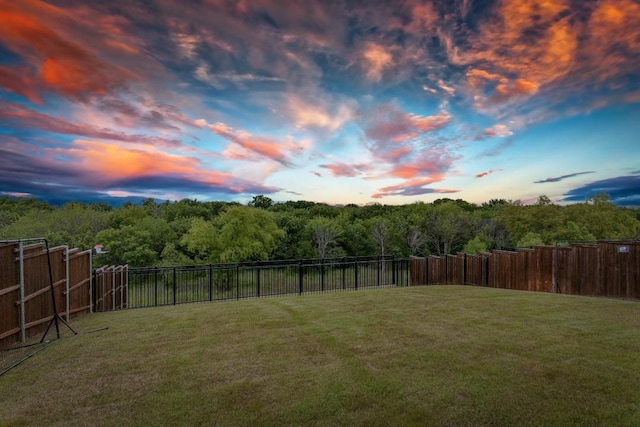 4837 Cumberland Cir, Carrollton, TX 75010 - yard at dusk with a view of trees