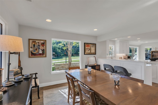 3405 Waterview Trl, Rockwall, TX 75087 - dining area with healthy amount of natural light, wood finished floors, baseboards, and recessed lighting