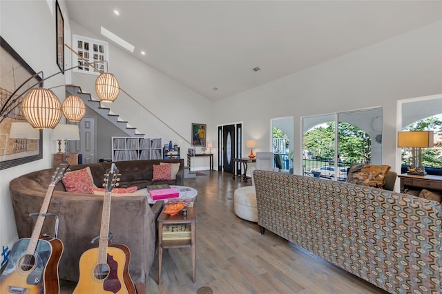 3405 Waterview Trl, Rockwall, TX 75087 - living room featuring high vaulted ceiling, stairway, wood finished floors, and recessed lighting