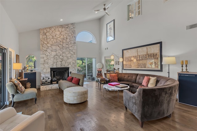 3405 Waterview Trl, Rockwall, TX 75087 - living room with high vaulted ceiling, a stone fireplace, ceiling fan, and wood finished floors
