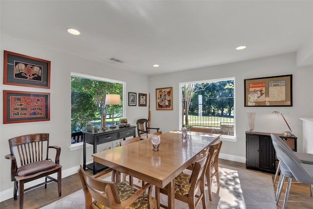 3405 Waterview Trl, Rockwall, TX 75087 - dining area with healthy amount of natural light, recessed lighting, wood finished floors, and baseboards