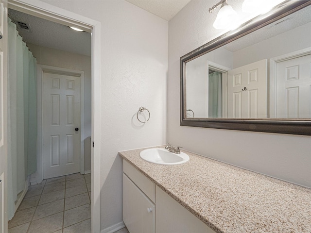4029 Aragon Dr, Fort Worth, TX 76133 - full bathroom with vanity, tile patterned floors, and a textured wall