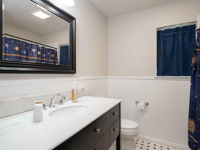 4029 Aragon Dr, Fort Worth, TX 76133 - full bath featuring vanity, a wainscoted wall, tile patterned floors, and curtained shower