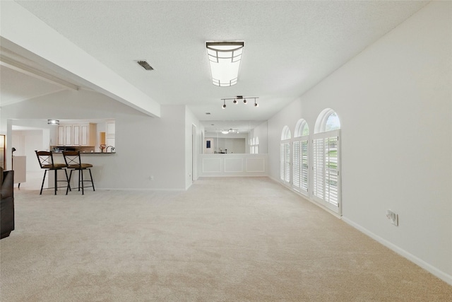 4029 Aragon Dr, Fort Worth, TX 76133 - unfurnished living room with carpet and rail lighting