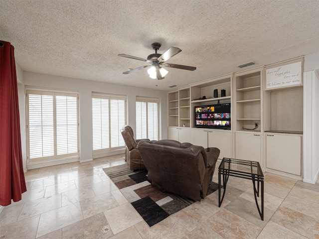4029 Aragon Dr, Fort Worth, TX 76133 - living room featuring ceiling fan and a textured ceiling