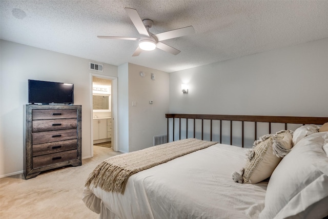7640 W Greenway Blvd Unit 5P, Dallas, TX 75209 - bedroom featuring light colored carpet, a textured ceiling, ceiling fan, and ensuite bathroom
