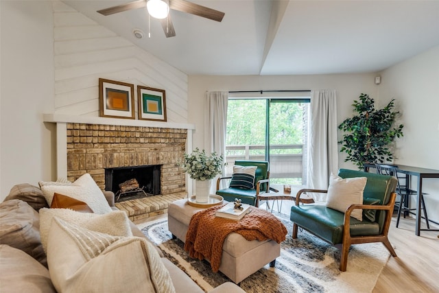 7640 W Greenway Blvd Unit 5P, Dallas, TX 75209 - living area featuring vaulted ceiling, ceiling fan, wood finished floors, and a brick fireplace