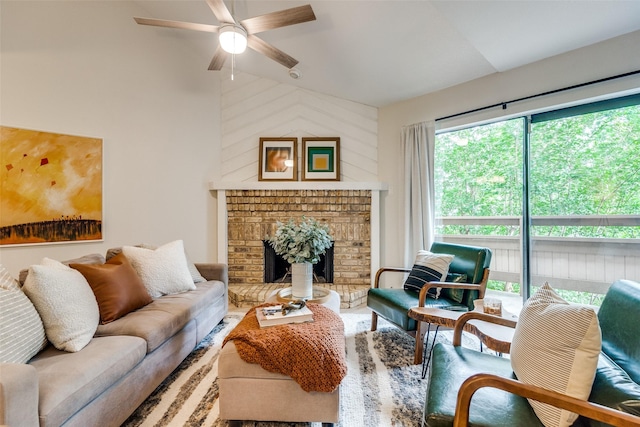 7640 W Greenway Blvd Unit 5P, Dallas, TX 75209 - living area with ceiling fan, lofted ceiling, and a brick fireplace