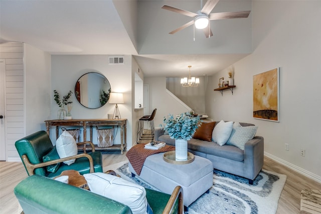 7640 W Greenway Blvd Unit 5P, Dallas, TX 75209 - living area with wood finished floors, a chandelier, baseboards, stairway, and ceiling fan