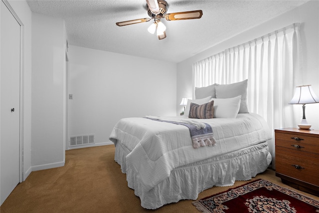 210 Harbor Dr, Gun Barrel City, TX 75156 - bedroom featuring light colored carpet, a textured ceiling, ceiling fan, and baseboards