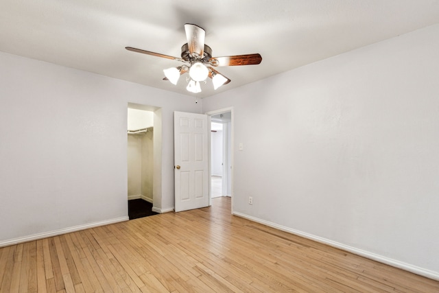 3843 Bernal Dr, Dallas, TX 75212 - unfurnished bedroom with light wood-style flooring, baseboards, a closet, and ceiling fan