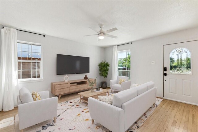 3843 Bernal Dr, Dallas, TX 75212 - living area with light wood-style flooring and a ceiling fan