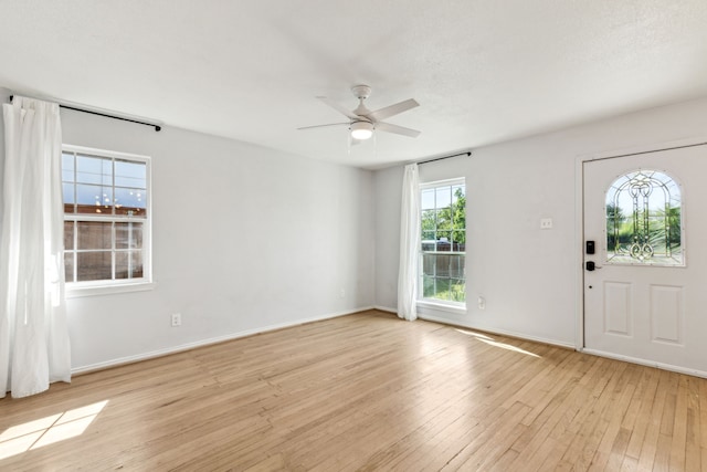 3843 Bernal Dr, Dallas, TX 75212 - entrance foyer featuring ceiling fan, light wood-style floors, and baseboards