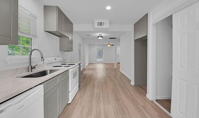 1413 Shelburne St, Waco, TX 76711 - kitchen with white appliances, a sink, gray cabinetry, and recessed lighting