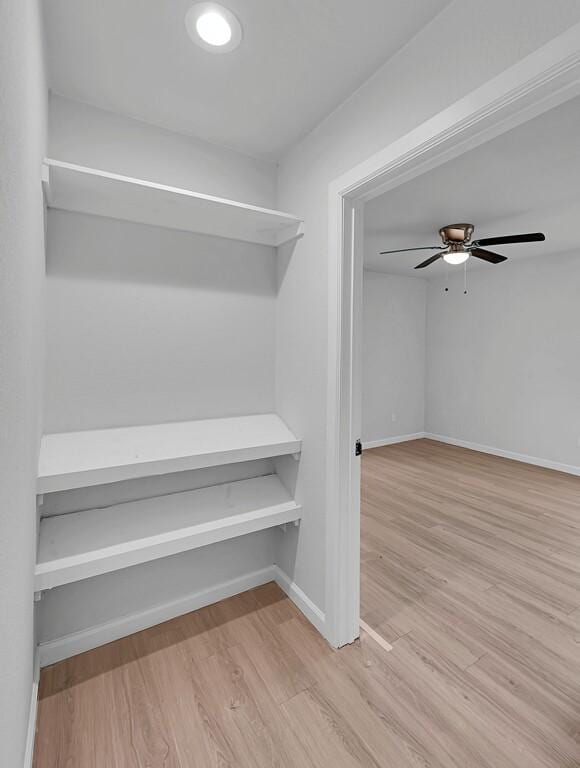 1413 Shelburne St, Waco, TX 76711 - spacious closet featuring wood finished floors and ceiling fan