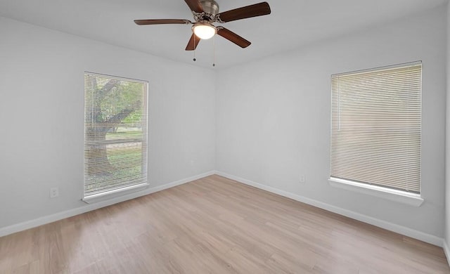 1413 Shelburne St, Waco, TX 76711 - spare room with light wood-type flooring, baseboards, and ceiling fan