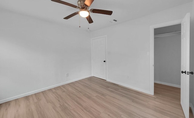 1413 Shelburne St, Waco, TX 76711 - unfurnished bedroom featuring light wood-style flooring, baseboards, a closet, and ceiling fan