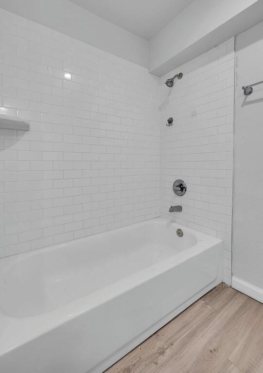 1413 Shelburne St, Waco, TX 76711 - full bath with wood finished floors and shower / bath combination