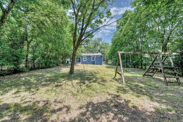 1413 Shelburne St, Waco, TX 76711 - view of green lawn featuring a playground