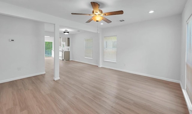 1413 Shelburne St, Waco, TX 76711 - spare room featuring ceiling fan, baseboards, light wood finished floors, and recessed lighting