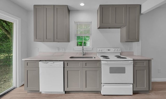 1413 Shelburne St, Waco, TX 76711 - kitchen with white appliances, gray cabinets, a sink, light countertops, and recessed lighting