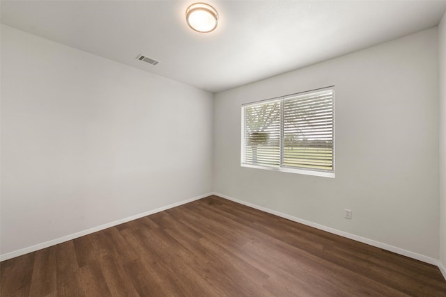 527 Dison Dr, Waco, TX 76706 - unfurnished room featuring dark wood-type flooring and baseboards