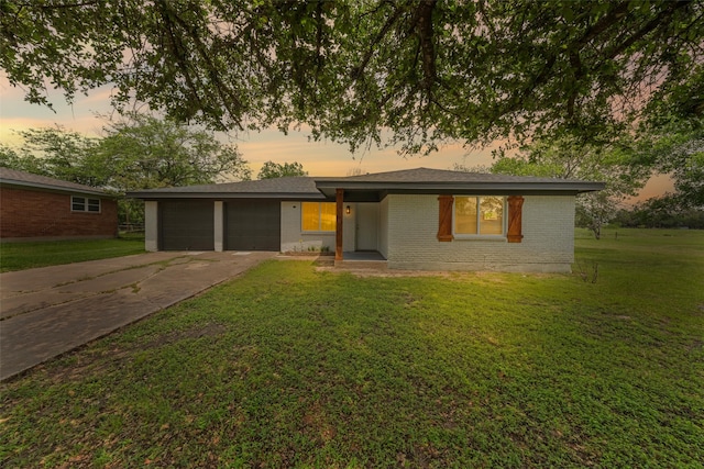 527 Dison Dr, Waco, TX 76706 - single story home featuring an attached garage, concrete driveway, brick siding, and a yard