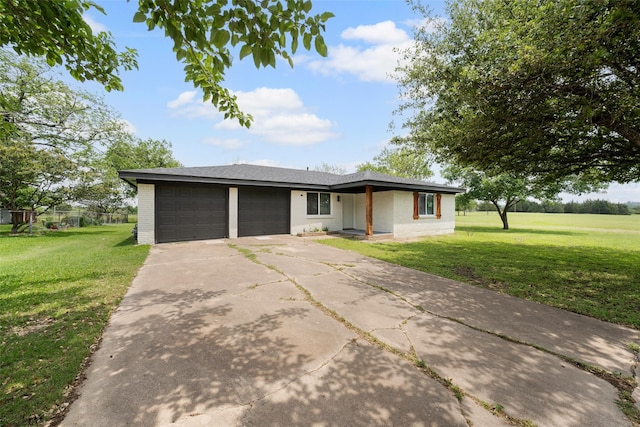 527 Dison Dr, Waco, TX 76706 - view of front facade with an attached garage, a front yard, concrete driveway, and brick siding