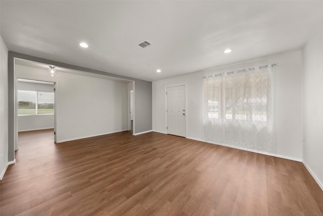 527 Dison Dr, Waco, TX 76706 - spare room featuring baseboards, wood finished floors, and recessed lighting