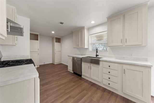 527 Dison Dr, Waco, TX 76706 - kitchen featuring dishwasher, a sink, dark wood-style floors, recessed lighting, and gas range