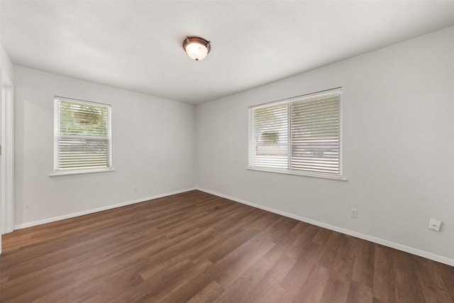527 Dison Dr, Waco, TX 76706 - empty room with dark wood-style floors and baseboards