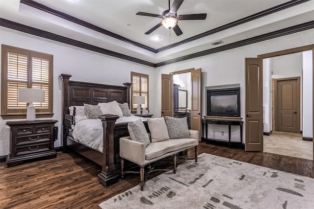 1716 Caman Park Dr, Lucas, TX 75002 - bedroom featuring crown molding, wood finished floors, a tray ceiling, a ceiling fan, and baseboards