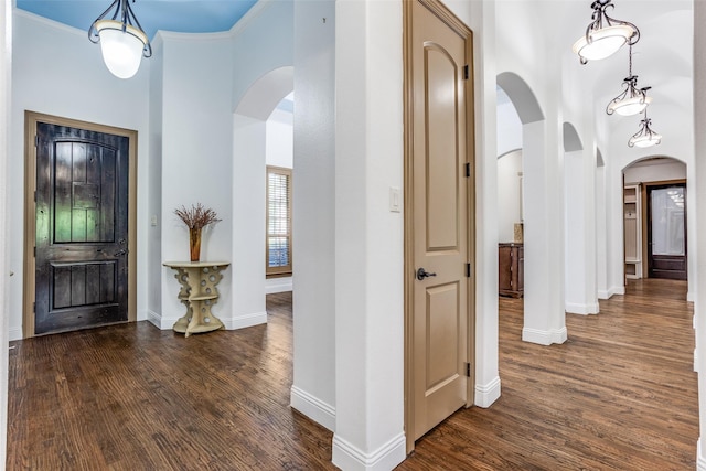 1716 Caman Park Dr, Lucas, TX 75002 - entryway with arched walkways, a towering ceiling, dark wood finished floors, and baseboards