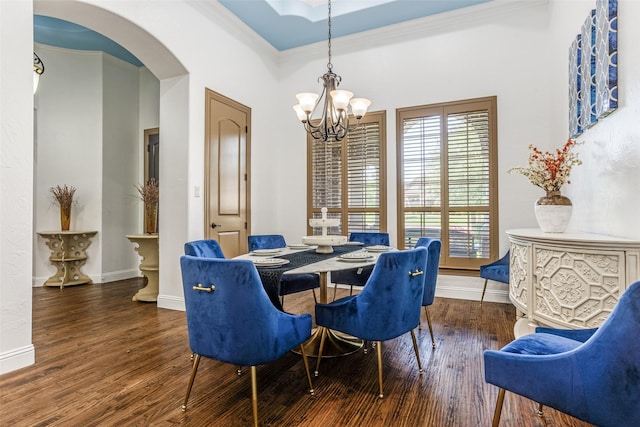 1716 Caman Park Dr, Lucas, TX 75002 - dining room featuring a chandelier, arched walkways, wood finished floors, crown molding, and baseboards