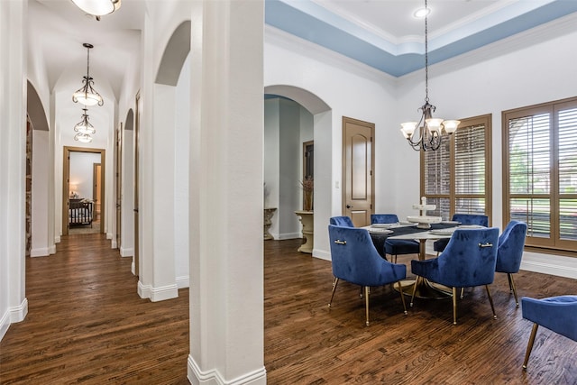 1716 Caman Park Dr, Lucas, TX 75002 - dining area featuring arched walkways, a chandelier, dark wood finished floors, baseboards, and crown molding