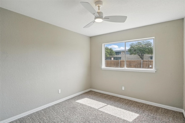 700 Brentwood Ln, Richardson, TX 75080 - spare room featuring carpet floors, baseboards, and ceiling fan