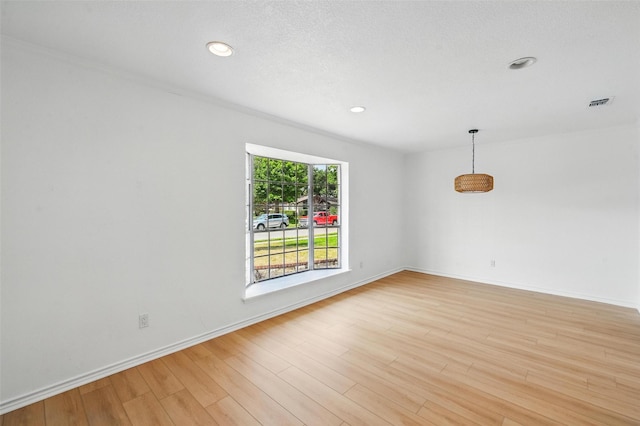 700 Brentwood Ln, Richardson, TX 75080 - unfurnished room with light wood-type flooring, recessed lighting, and baseboards