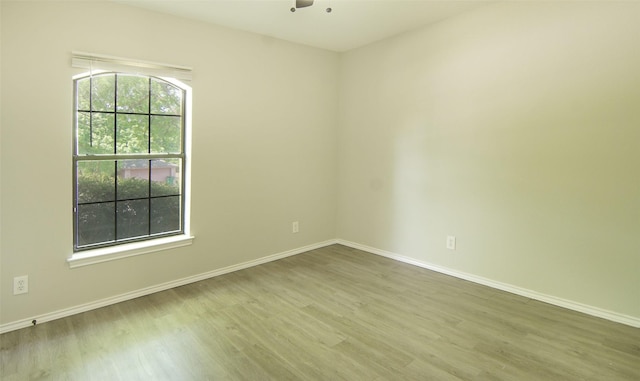 602 Valleyridge Ct, Decatur, TX 76234 - spare room featuring wood finished floors, baseboards, and ceiling fan