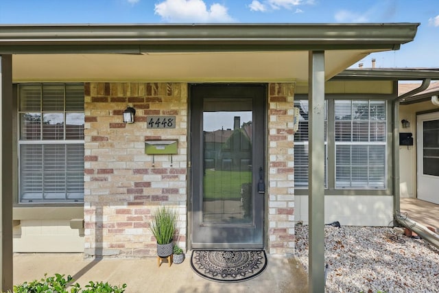 4448 Wind River Ln, Garland, TX 75042 - entrance to property with brick siding and covered porch