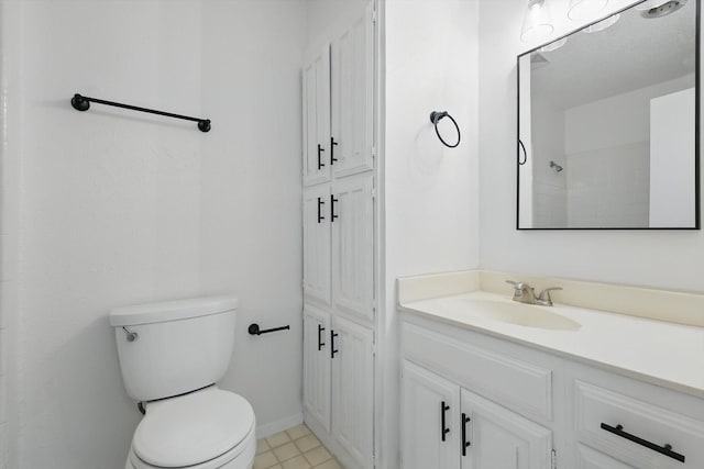 4448 Wind River Ln, Garland, TX 75042 - bathroom featuring toilet, vanity, and baseboards