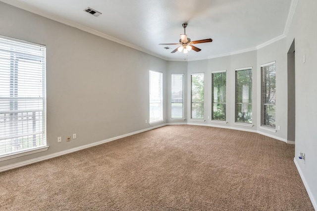 4145 Victory Dr, Frisco, TX 75034 - carpeted empty room featuring a ceiling fan, plenty of natural light, ornamental molding, and baseboards