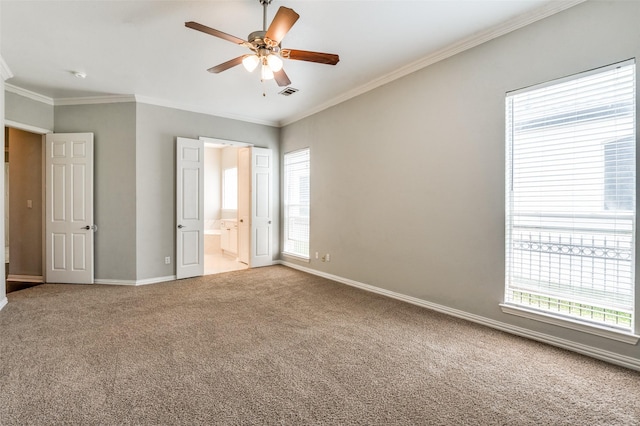 4145 Victory Dr, Frisco, TX 75034 - unfurnished bedroom with crown molding, multiple windows, carpet floors, baseboards, and connected bathroom