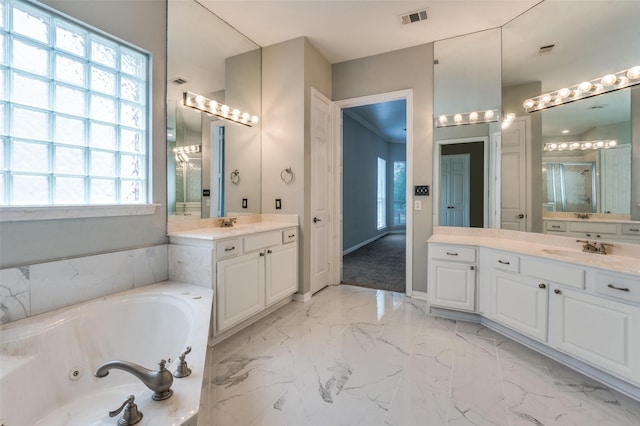 4145 Victory Dr, Frisco, TX 75034 - full bath with a jetted tub, two vanities, a shower stall, marble finish floors, and baseboards
