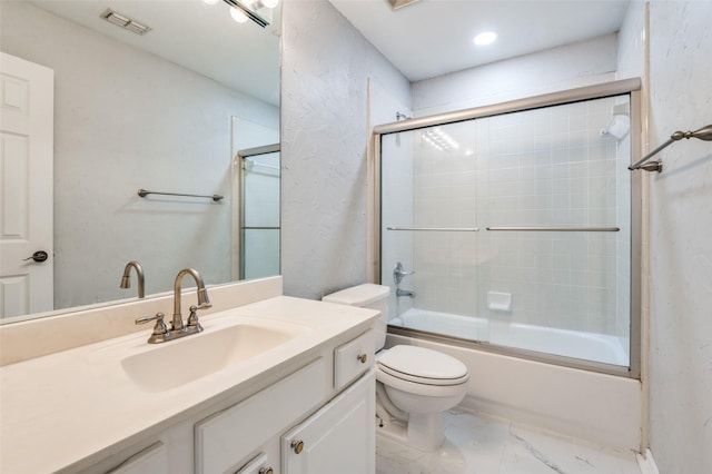 4145 Victory Dr, Frisco, TX 75034 - bathroom featuring toilet, vanity, shower / bath combination with glass door, marble finish floors, and recessed lighting